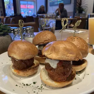 Meatball sliders with big screen in the background