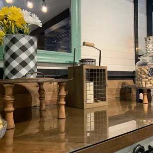 a counter with a vase of flowers