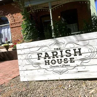 Our sign, built with reclaimed hardwood planks from the kitchen house out back.