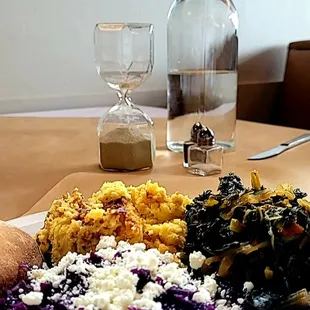 Braised purple cabbage w/goat cheese, cornbread pudding, greens, roll.