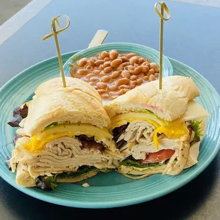 Smoked turkey club with a fried egg &amp; baked beans on the side