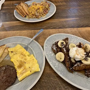 two plates of breakfast foods