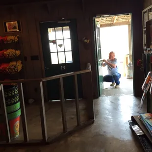 a woman sitting in the doorway