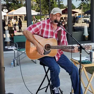 a man playing a guitar