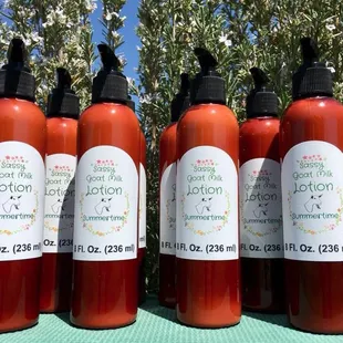 a row of four bottles of lotion
