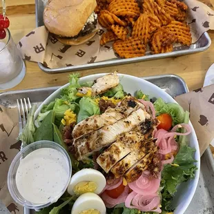 Cobb salad and black &amp; bleu burger with sweet potato fries