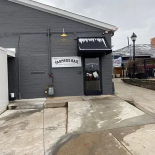 The back door with a lot of parking in back.