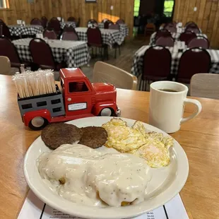 a plate of food and a cup of coffee