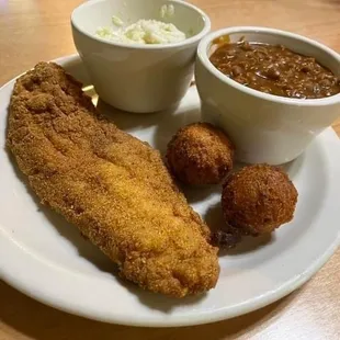 a plate of fried fish and beans