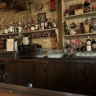 a bar with bottles and glasses