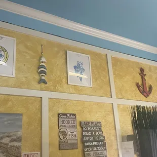 a variety of nautical decor on the wall