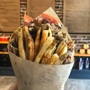 Gyro wrapped in Pita with Tzatziki, Tomatoes, Onions &amp; Fries