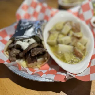 a bowl of soup and a sandwich