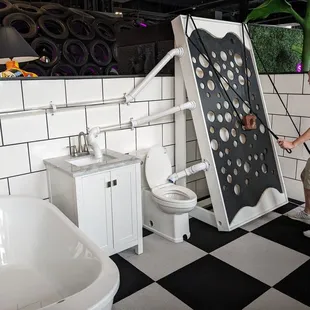 a man standing in front of a toilet