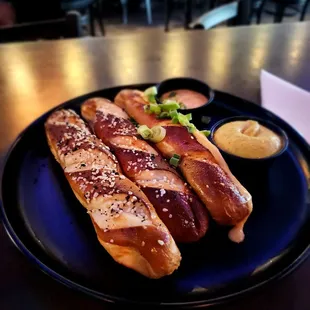 Pretzel Flight - L to R.  Everything, Salt, and Sriracha. Served with beer cheese and brown mustard.