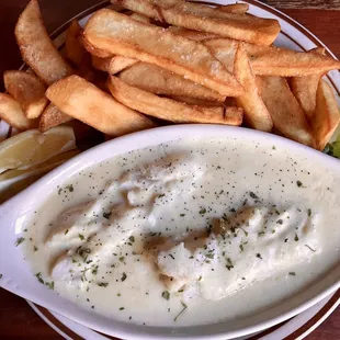 Fish &amp; Chips, broiled in white wine and garlic sauce