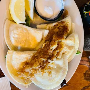Pierogi&apos;s and they were simply delicious. They were fresh, hot potato filling, sauté cabbage and sour cream.