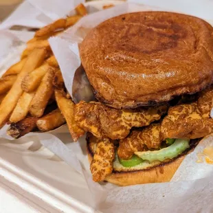 Buffalo chicken sandwich with a side of fries