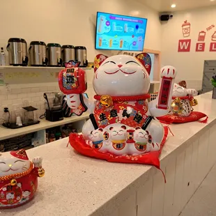 Lucky cats inside restaurant