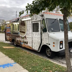 a food truck parked on the side of the road