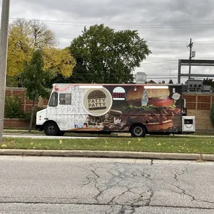 a food truck parked on the side of the road