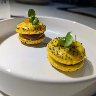 First canape. Lemon Poppy Macarons with Foie Gras Ganache.