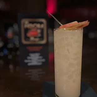 a drink with a garnish on top