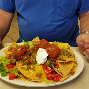 Half of the home made nachos went home for dinner