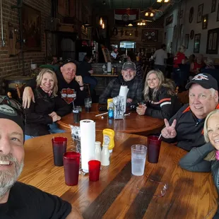 a group of people sitting at a table