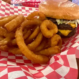 a hamburger and onion rings