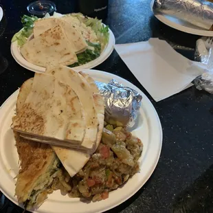 The chicken gyro dinner with a Greek salad, spanakopita and eggplant.