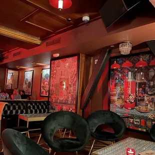 a brightly lit restaurant with red lighting