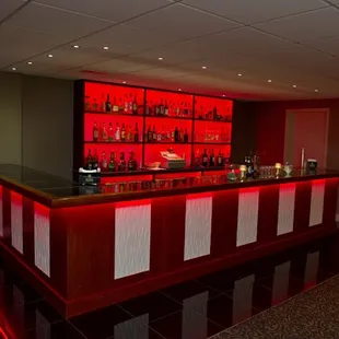 Full bar setup for special event with red lighting