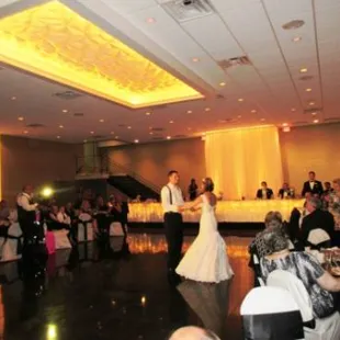 bride and groom dance at wedding reception