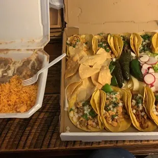 a box of tacos and a container of rice