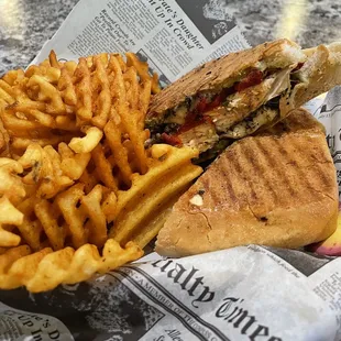 Roasted chicken and red pepper panini with waffle fries