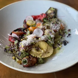 a plate of pasta with vegetables