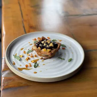 a plate of food on a wooden table