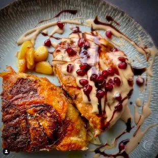 Mince Stuffed Pork Chop with Pomegranate Molasses Cream Sauce served with our own Jerk Scallop Potato Wedge.