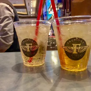 two glasses of beer on a bar