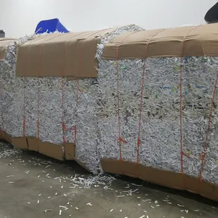 Bales of shredded paper ready to be recycled.