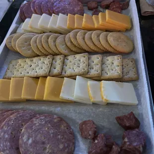 a variety of cheese and crackers