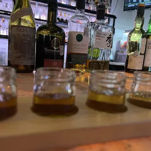 a row of empty glasses on a bar