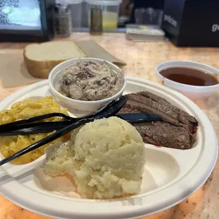 Two meat plate. Brisket. Chicken salad. Mac n cheese. Potato salad.