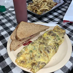 Western Omelet with wheat toast &amp; french fries.