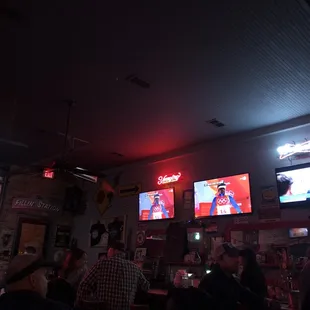  group of people watching televisions