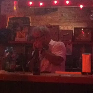 The owner Patrick playing his harmonica