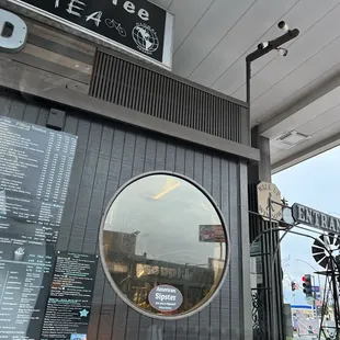 the reflection of the building in the window