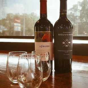 two bottles of wine and two wine glasses