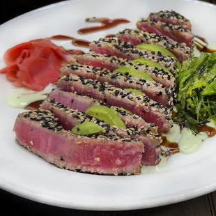 a plate of food with meat and vegetables